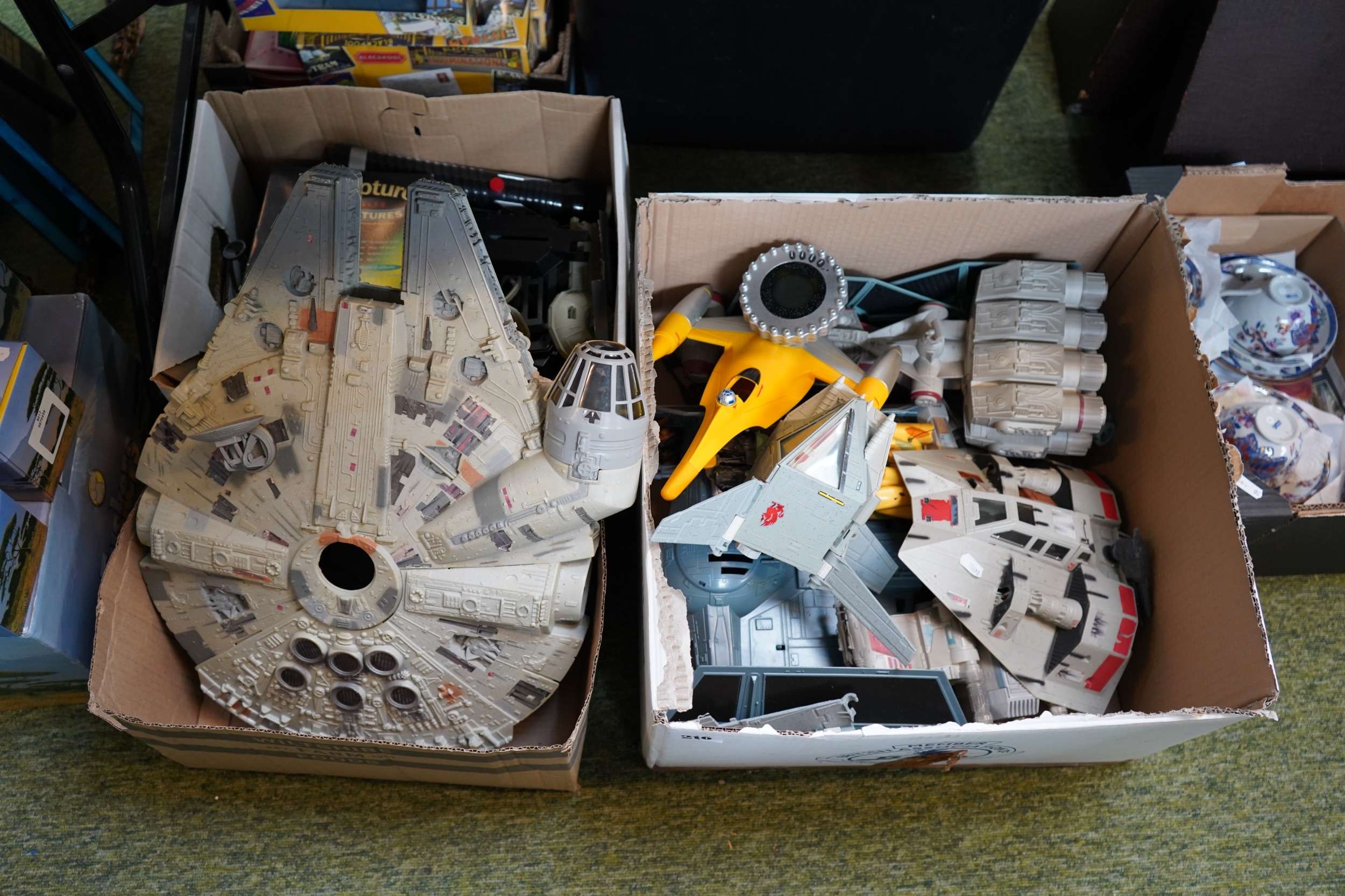 A vintage Kenner Millennium Falcon and Imperial Shuttle Tydirium playset in their boxes, plus loose Star Wars vehicles, found in a garage clearance